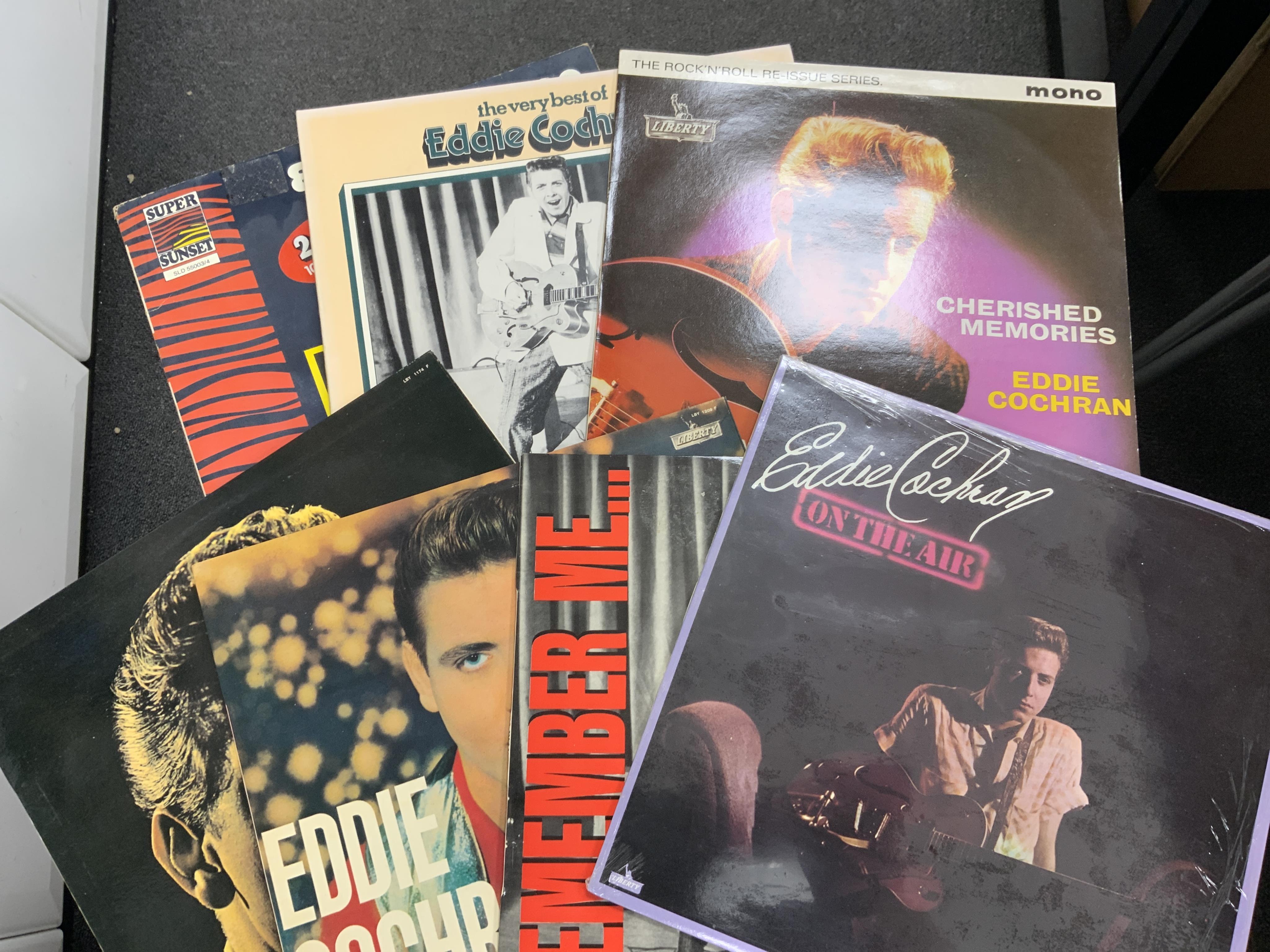 Sixty-two Elvis Presley and Eddie Cochran LP record albums, including forty-six Elvis Presley albums and compilations, together with sixteen Eddie Cochran albums, including duplicates of several albums. Condition - fair